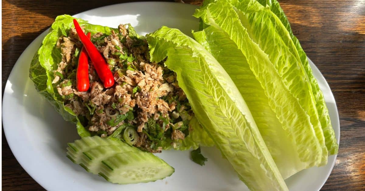 Vegan Laab served with lettuce leaves and cucumber