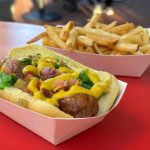 Chicago-style vegan hot dog at Disney World with a side of fires