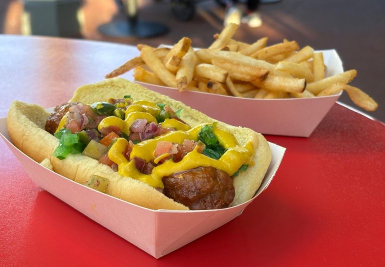 Chicago-style vegan hot dog at Disney World with a side of fires